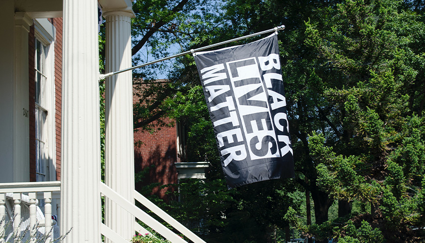 Black Lives Matter flag hanging on porch
