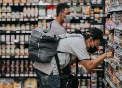 Two men in grocery aisle, shopping