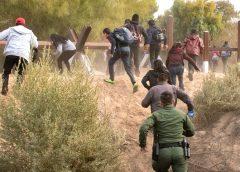 CBP Officer chasing illegal border crossers