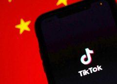 TikTok app in front of Chinese flag